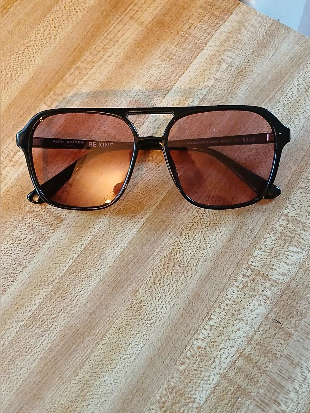 Kurt Geiger Black Frame Sunglasses with Pink Lenses